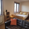 Photo 9: Leather sofa in room