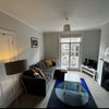 Photo 8: other side of the living room, currently not furnished like this, (this photo shows the width best),