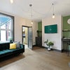 Photo 3: Separate living room with sofas and large TV
