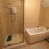 Photo 9: Shower/bathroom.