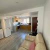 Photo 7: Communal kitchen and seating area.