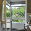 Photo 3: Kitchen window view to front with mini balcony