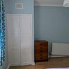 Photo 2: The radiator isn't falling off the wall - it was installed that way! 
