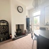 Photo 2: Dining room with log burner