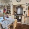 Photo 3: Spacious well equipped kitchen. Large range and own storage areas