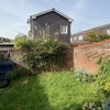 Photo 9: Low maintenance garden, which would welcome a greenthumb