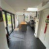Photo 7: Kitchen bifold doors opening onto the garden 