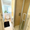 Photo 8: 2 shower rooms each with a toilet, sink, and shower, hot water on demand