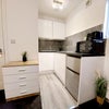 Photo 4: Kitchenette provided with bin cupboard, fridge freezer, toaster, kettle and microwave