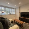 Photo 7: Bright living room with large sofa & 55” TV – perfect to unwind