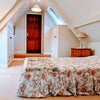 Photo 7:  Sunny double bedroom with spacious cupboards and views of front and of garden