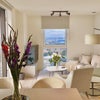 Photo 3: Differnt dining set currently in flat and TV has been removed. 