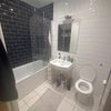 Photo 4: Shared bathroom + toilet on first floor