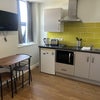 Photo 1: Kitchenette & dining table/chairs
