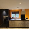 Photo 2: Open-plan kitchen