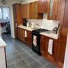 Photo 6: Kitchen with laundry in the back