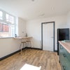 Photo 14: COMMUNAL KITCHEN