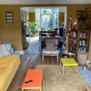 Photo 6: living room with tv and woodburner, adjoining dining room