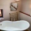 Photo 9: shared tub room and laundry on top floor