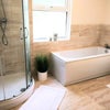 Photo 5: Large bright bathroom.