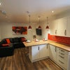 Photo 6: A large kitchen lounge to socialise with ample storage individual and shared storage.