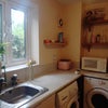 Photo 9: Kitchen with washing machine and dryer