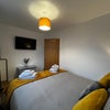 Photo 3: Spacious bedroom with Smart TV and plenty of storage