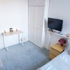 Photo 2:  High ceilings so it fees big. Office chair not in photo