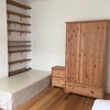 Photo 2: The single bed with drawers and wardrobe of the bedroom
