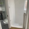 Photo 7: Top of stairs going down- coat hooks on wall, window has London cityscape viewS