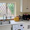 Photo 2: A separate kitchen space with plenty of storage