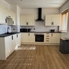 Photo 2: Brand new kitchen with integrated appliances. 2 No. fridge/freezers.