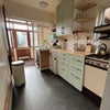 Photo 4: kitchen with sunroom/utility beyond