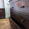 Photo 3: Deep and wide chest of drawers. Total drawers in the room; 4 large, 6 small, plus ottoman.