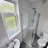 Photo 7: Bright bathroom with rain shower