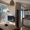Photo 2: Living area/kitchen