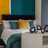 Photo 3: Double bed, modern wardrobe and fresh décor, move-in ready.