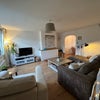 Photo 4: Shared living room with TV