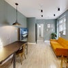 Photo 2: Open-plan communal area : Sofa, large TV, dining table, study desk.