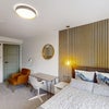 Photo 7: Self-contained studio: kitchenette, built-in fridge, sink, sofa and ensuite.