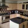 Photo 2: Beautiful kitchen with oven , fridge,dryer, washing machine and storage shelf etc...