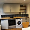 Photo 2: Brand new kitchenette, oven, washing machine, and real oak floors
