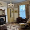 Photo 2: Front sitting room overlooking street