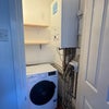 Photo 3: Separate laundry room with washing machine + shelving