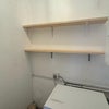 Photo 4: Separate laundry room with washing machine + shelving