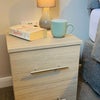 Photo 5: Room 2: Two drawer bedside cabinet and lamp