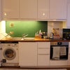 Photo 7: Washing machine / kitchen and storage 
