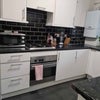 Photo 4: Kitchen with washer-dryer 
