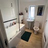 Photo 3: Pne of 2 super bathrooms,large  P-shaped bath with shower over 