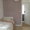 Photo 2: Bed as single showing door to walk in wardrobe